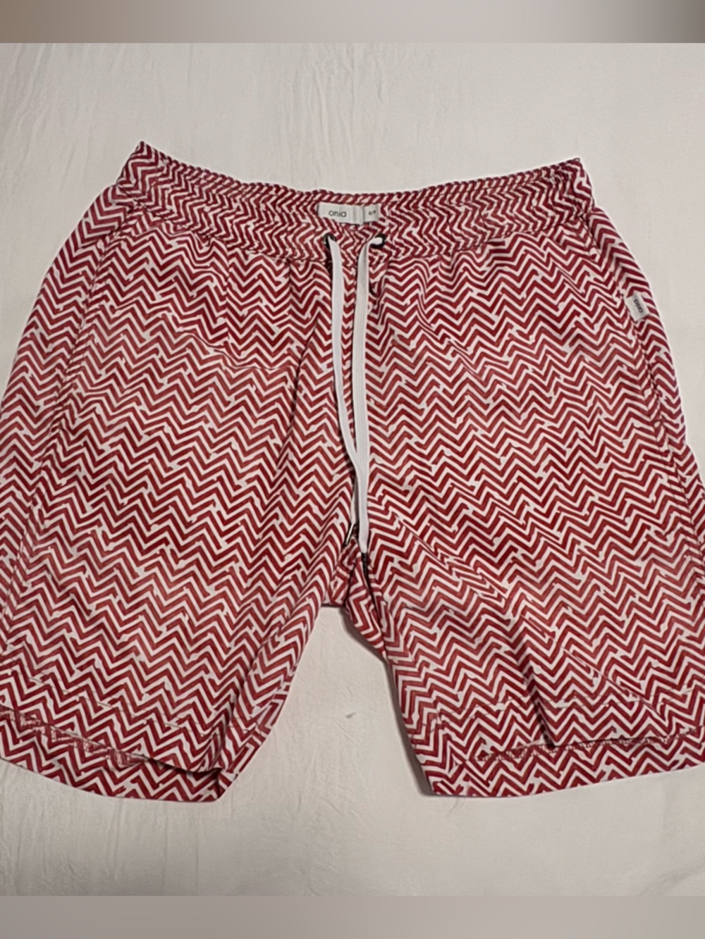 Onia Red Chevron Charles 7” swim trunks